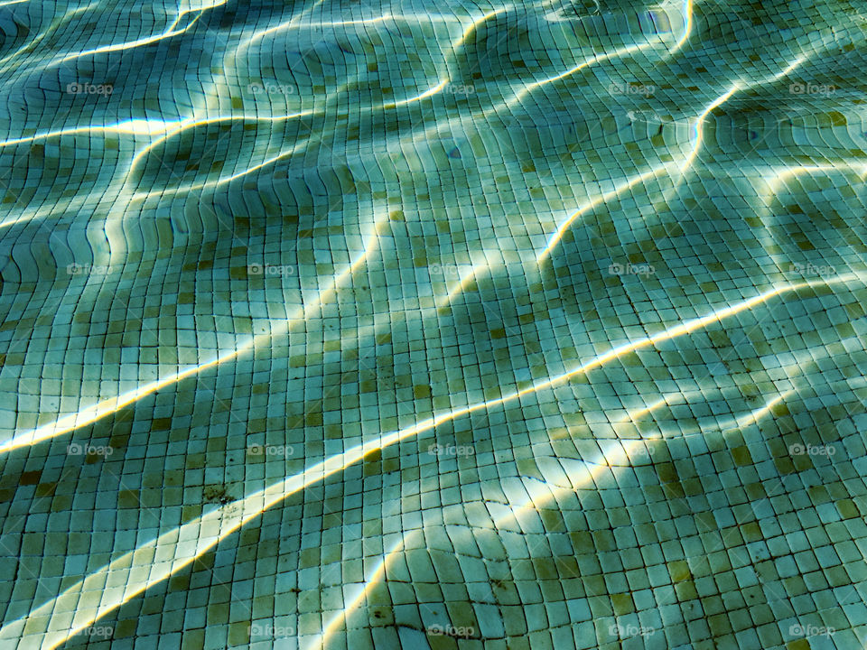 Water reflections in a swimming pool