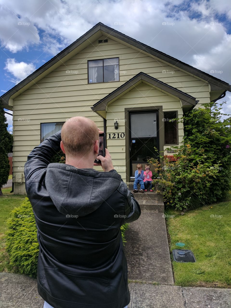 Matt took the kids picture while I took his. The house is Kurt Cobain"s childhood home. Matt wanted to visit so we had to take some pics.