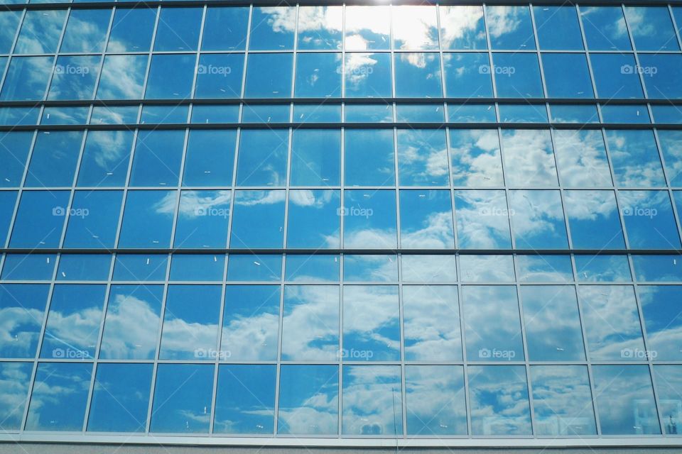 Reflection of sky and clouds in glass