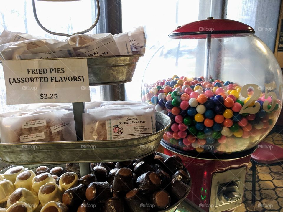 local pastries and gumball machine in window