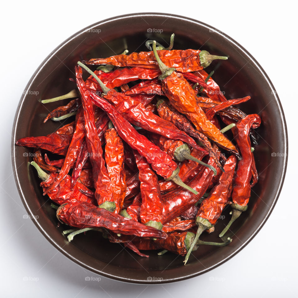 Red chilli peppers on bowl