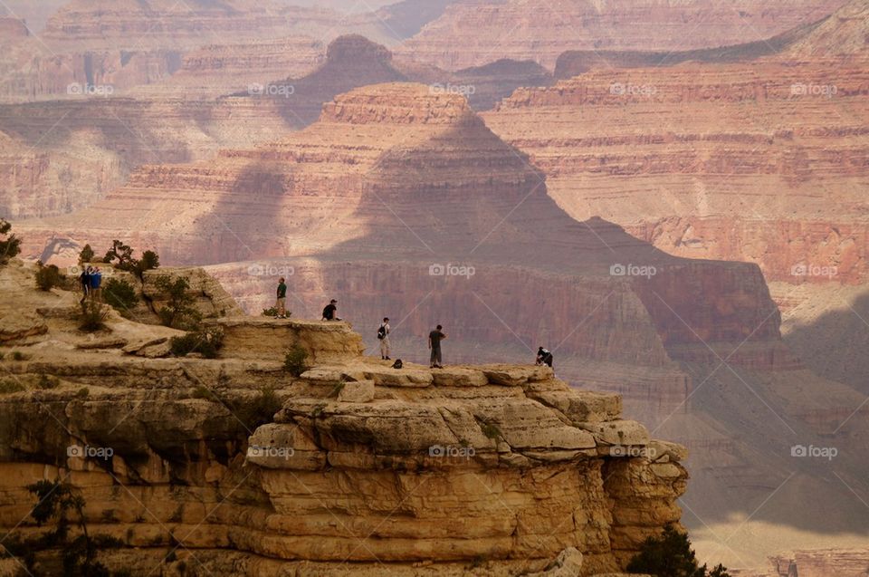 People standing on the cliff