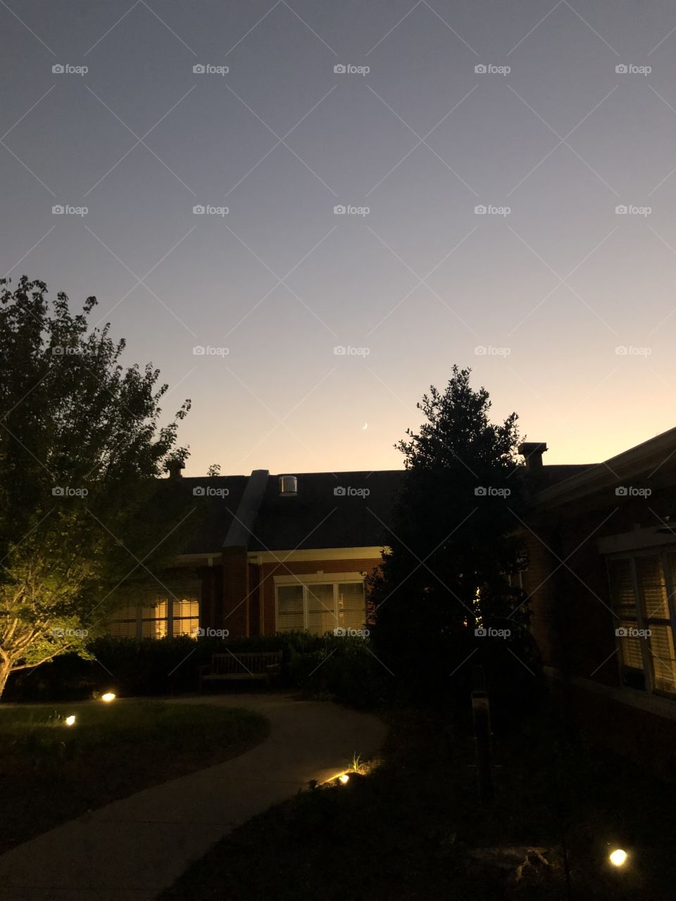 The moon as the sun sets