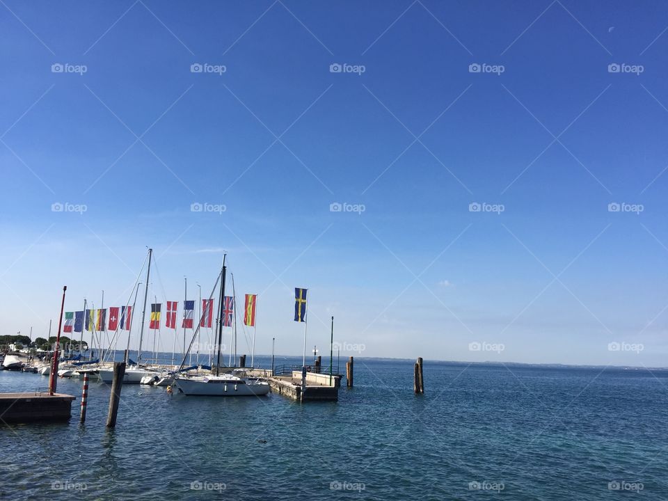 European flags at the harbor in Bardolino at Lake Garda