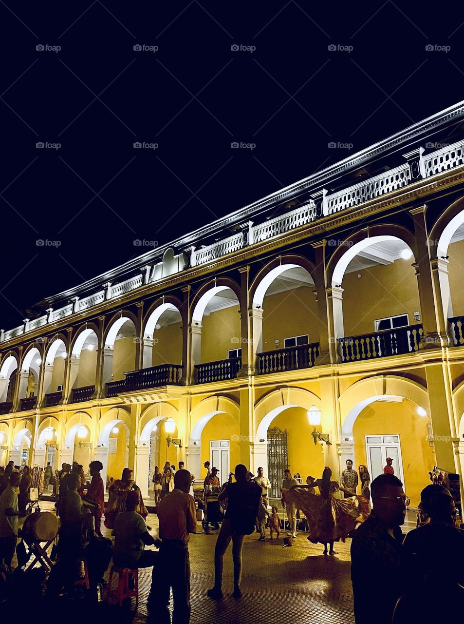 A crowd square in Cartagena at night-dancing and meeting 