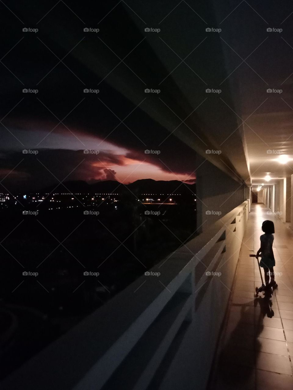 Kid watching sunset