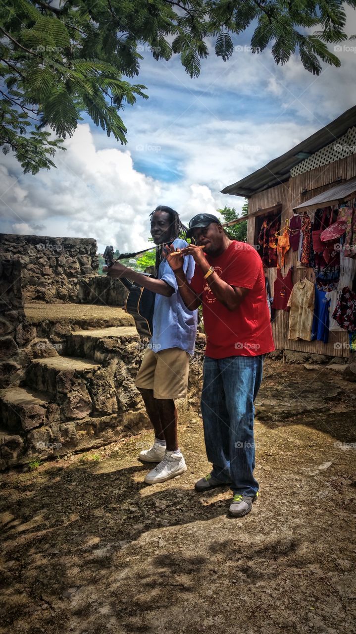 Islander's playing a tune lol. St Lucia..The gentleman in the red was our tour guide..