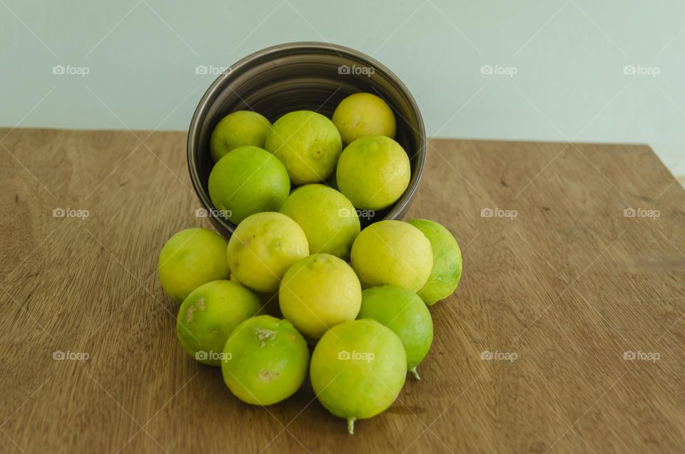 Toppled Dish Of Limes