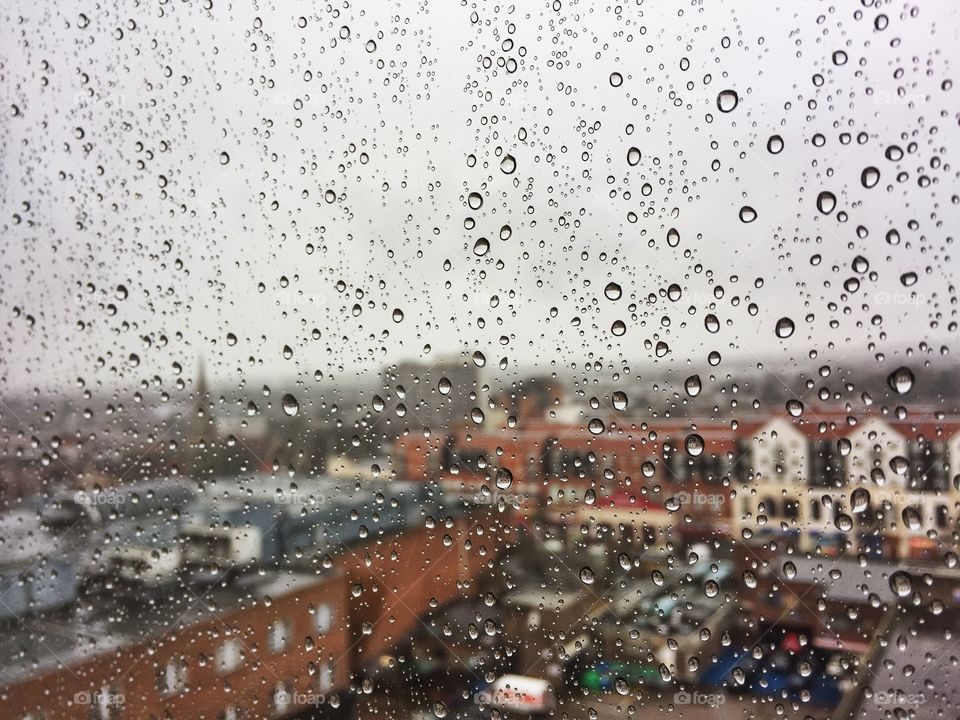 View of Romford town street on a rainy day through a window