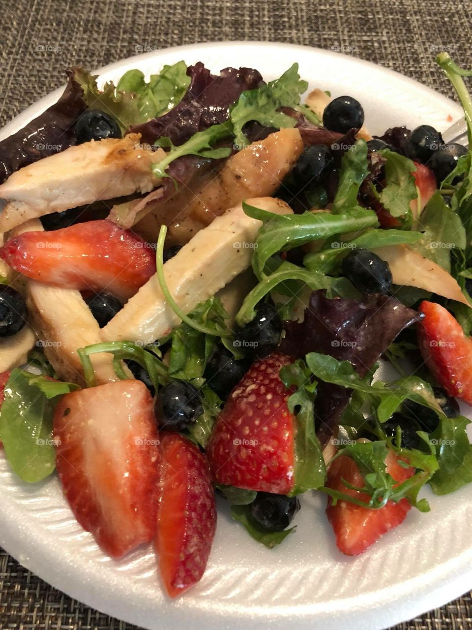 Flavorful Healthy Salad with Grilled Chicken and Berries glazed with honey mustard sauce.