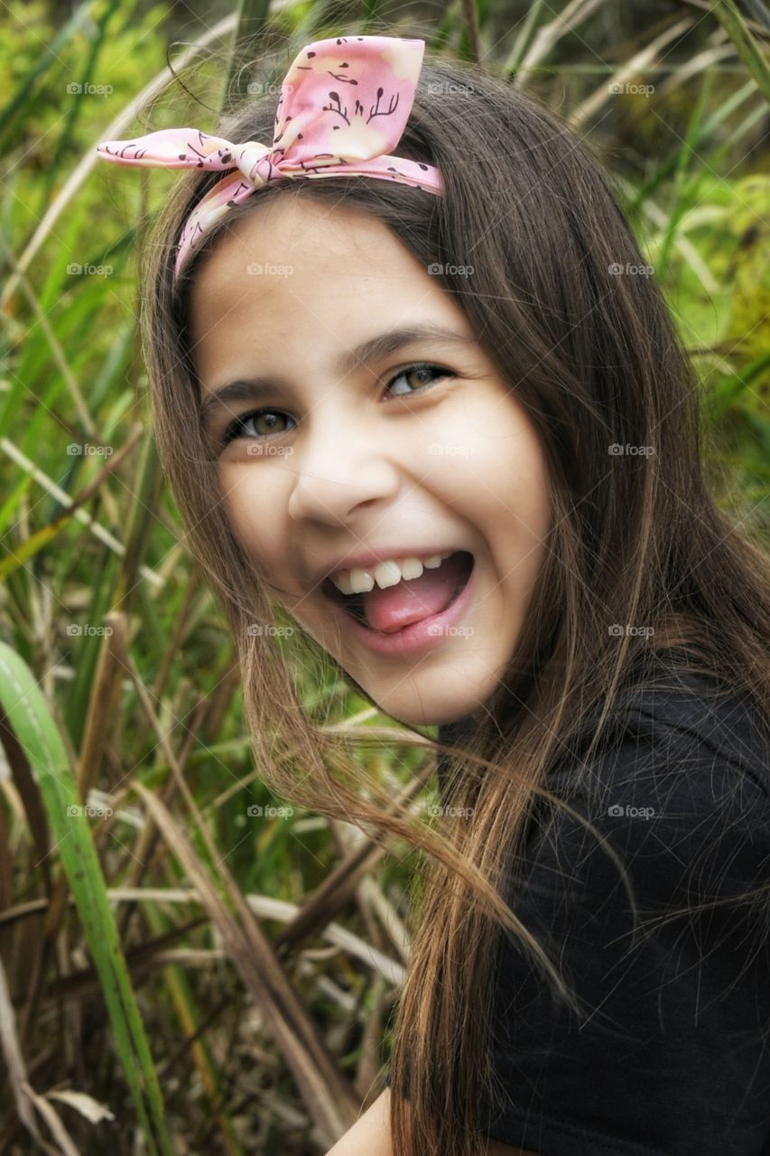 A happy girl looking at camera.