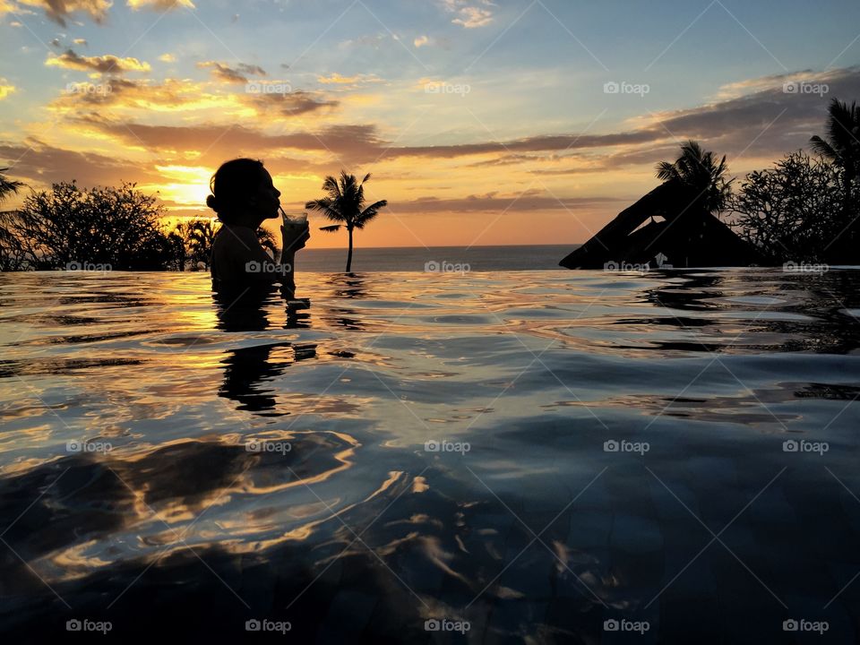 Bali. Pool during sunset in Bali 