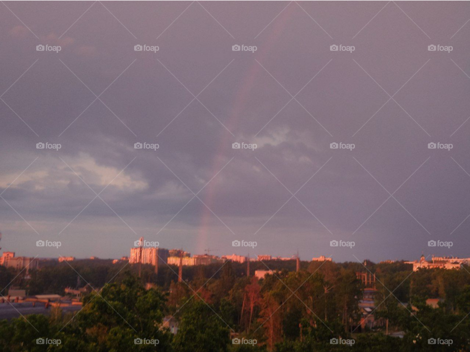 beautiful sunset with rainbow and clouds