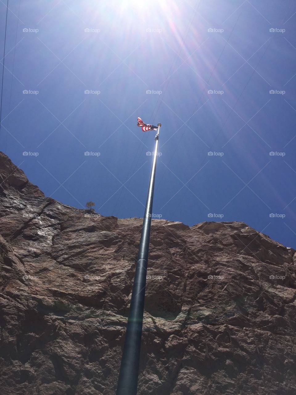 Home of the free because of the brave.   This flag flies at the Hoover Dam