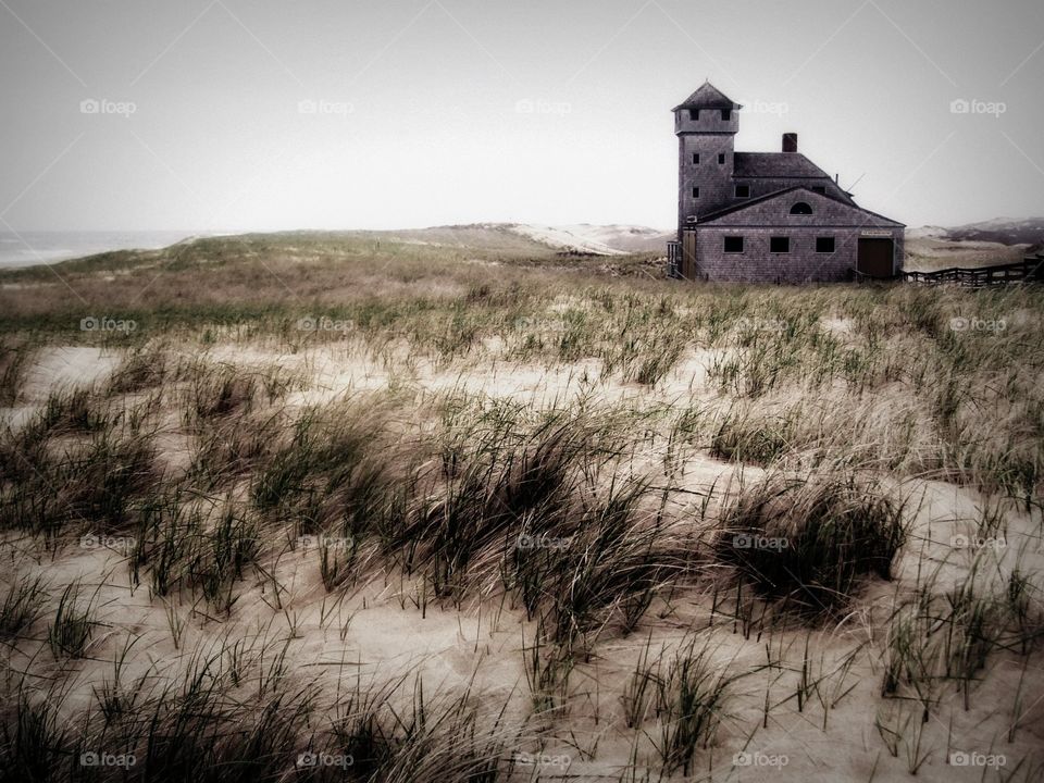 Cape cod house. Lighthouse in cape cod
