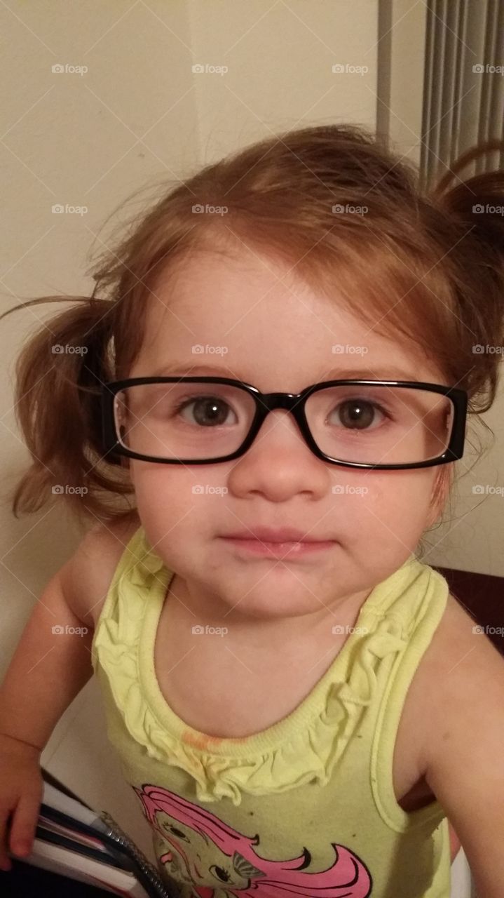 Nerd Alert. My sweet girl trying on my glasses
