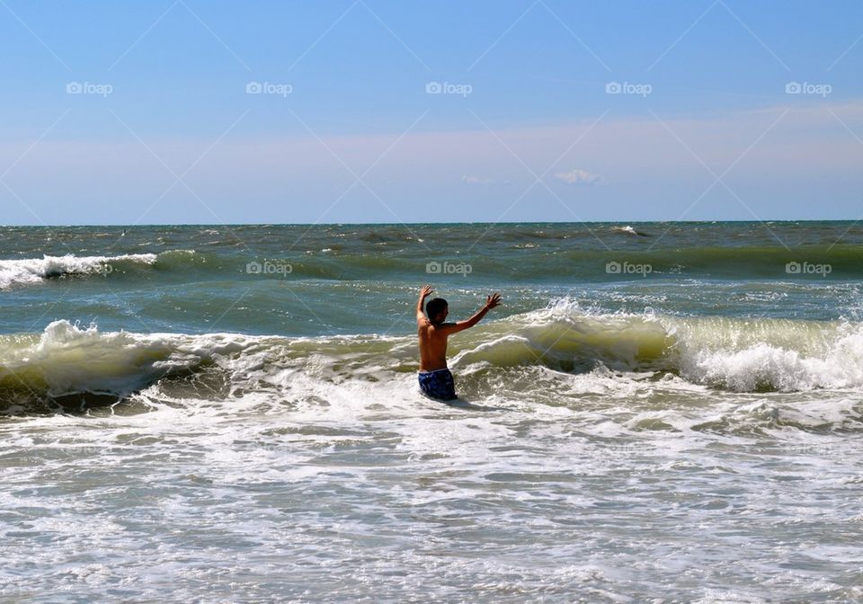 Boy in waves