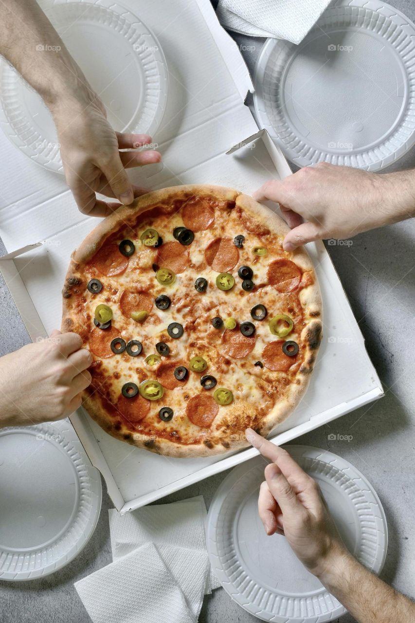 People eating delicious pizza 