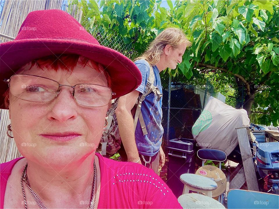 I, „Petra Schiller“ and my longtime partner „Timothy Trespas“ sit on the veranda the locals have built here at „Newtown Creek“ in LIC, Queens before we return to our boat, the „Salvation“. 2023. Hypnotic Productions