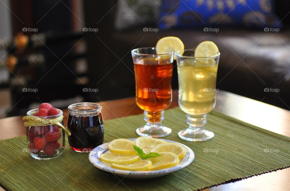 A glass of harbal tea on table