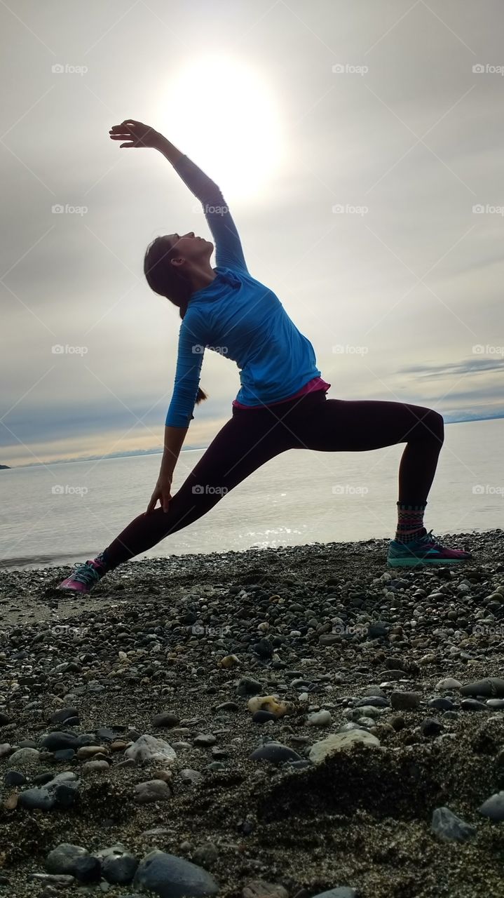 Yoga on the Alaskan beach under the midnight sun