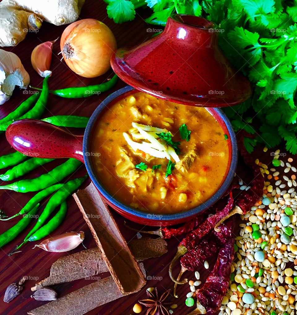 Homemade Comfortfood for cold days - meat broth with fresh slivered ginger for garnish 