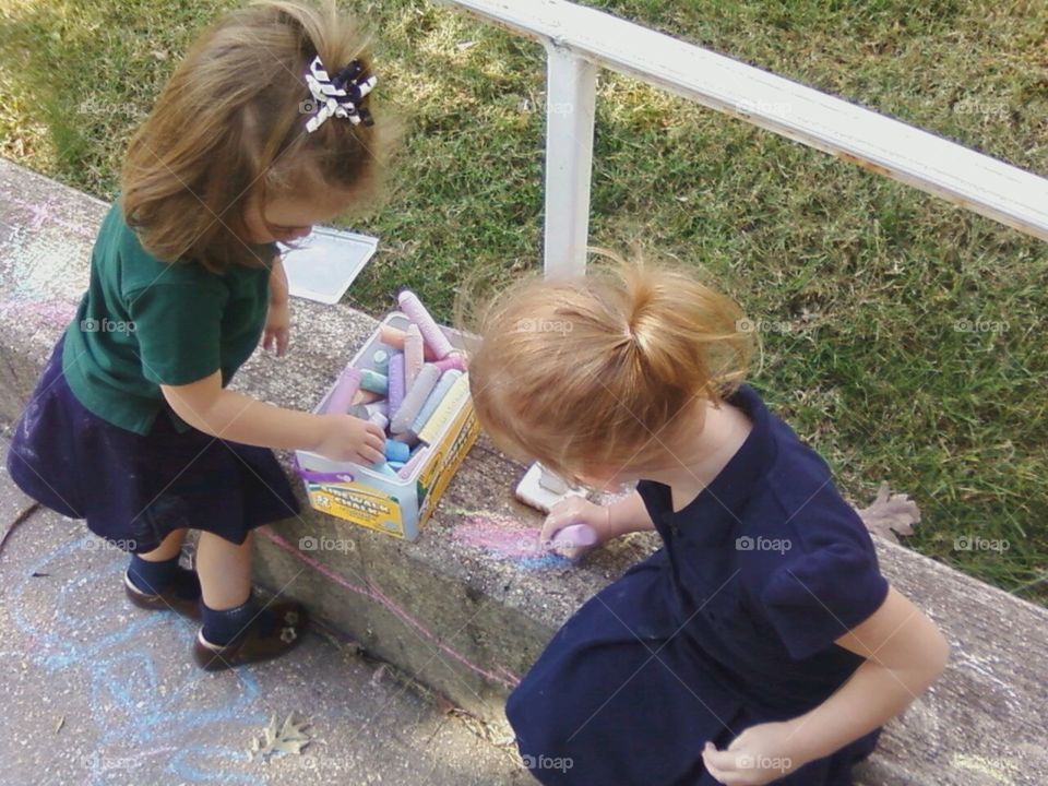 Children drawing outside 