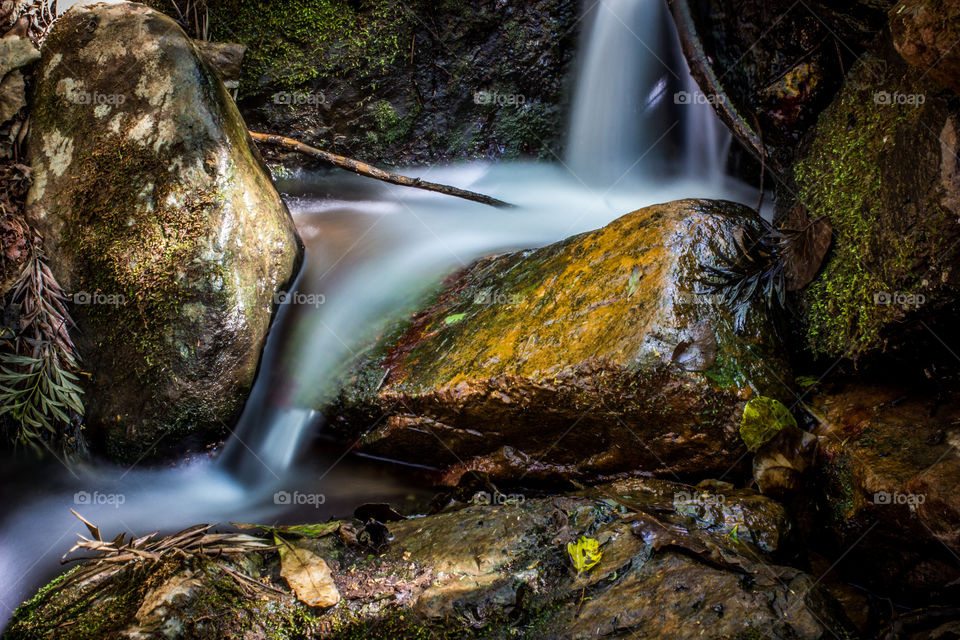 stream running over a rock