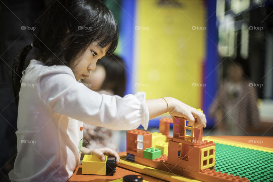 Japanese child playing toy block