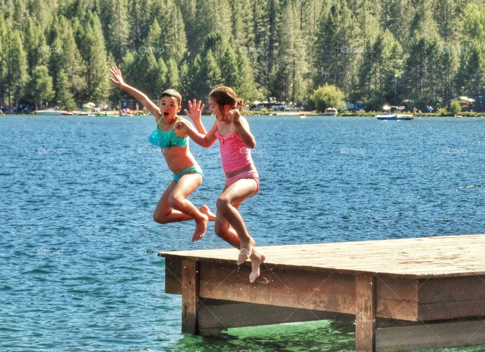 Girls Jumping In A Lake 