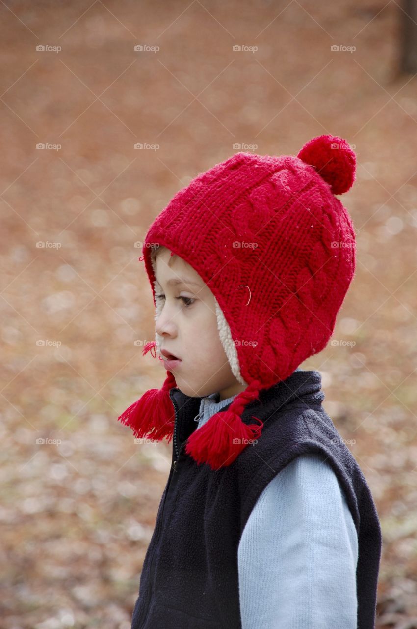 Cute boy wearing knitted hat