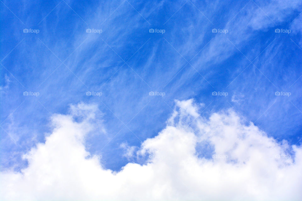 Blue sky with white clouds. Abstract blue and white background.