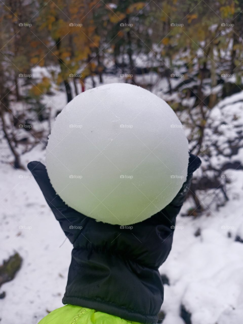 Snow ball made with hand.