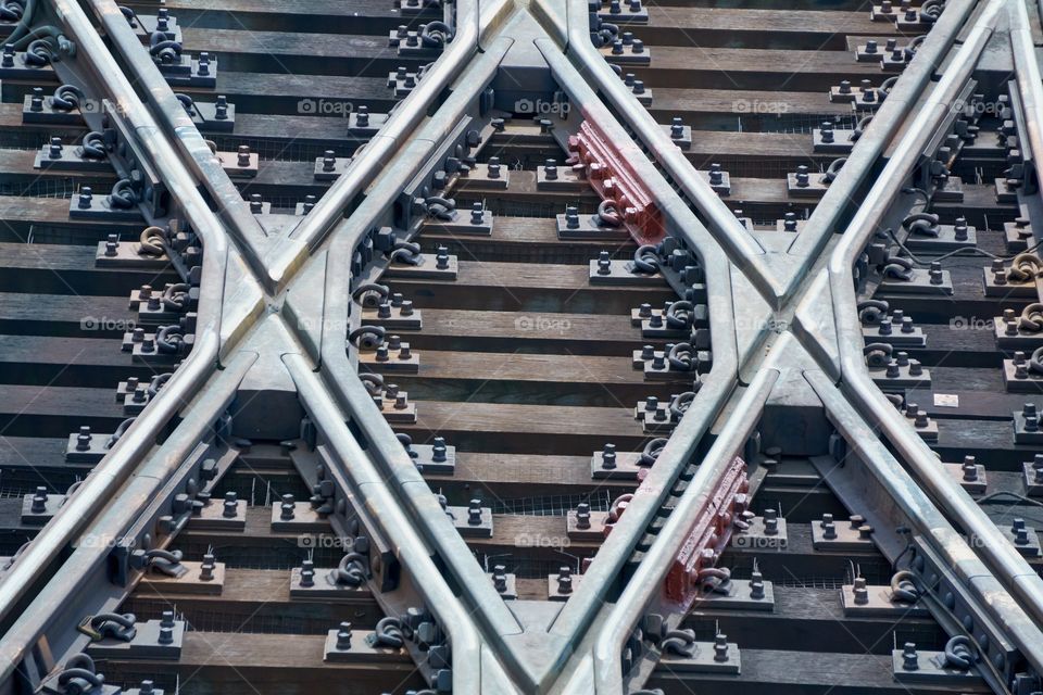 An abstract of switch tracks from an above view of a subway train yard in New York City .