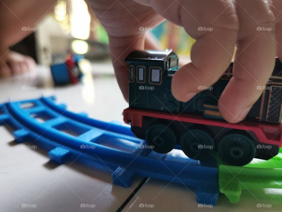 My son playing with the train toy