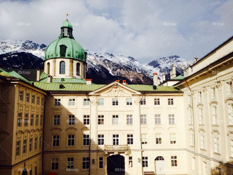 hofburf palace with snow mountains background in Innsbruck 