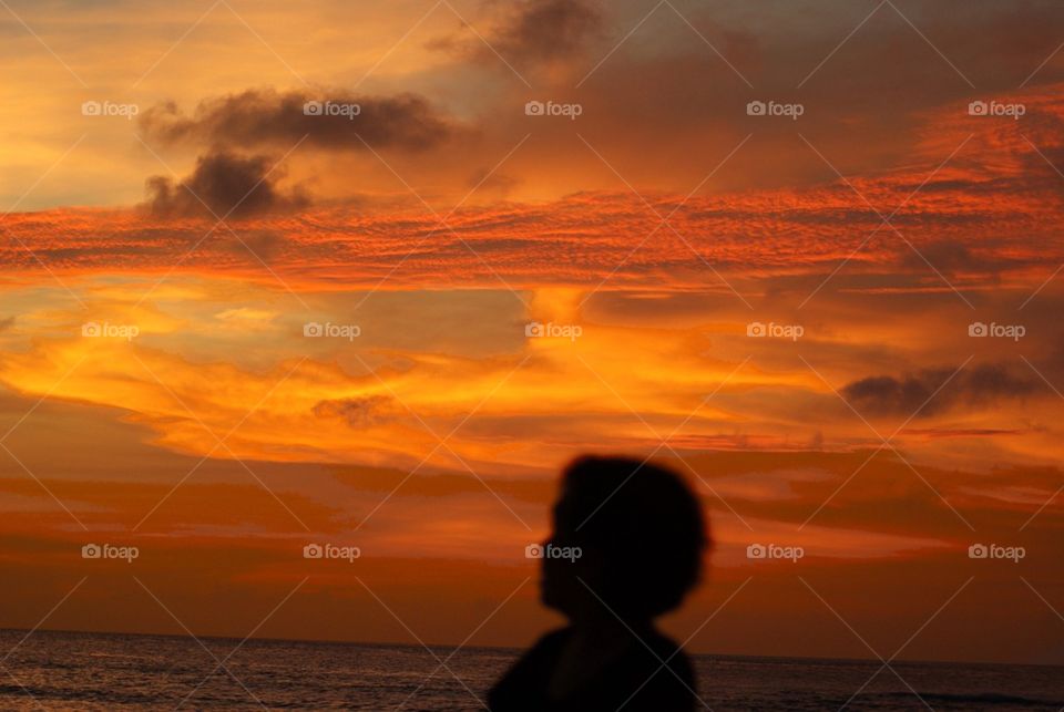Silhouette of a boy against sky