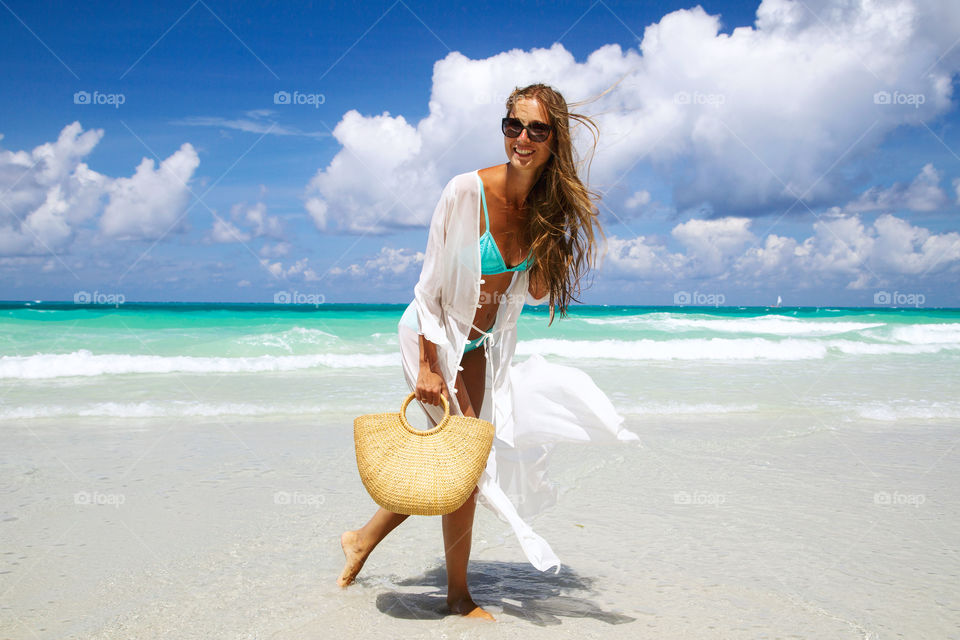 Happy woman on the beach 