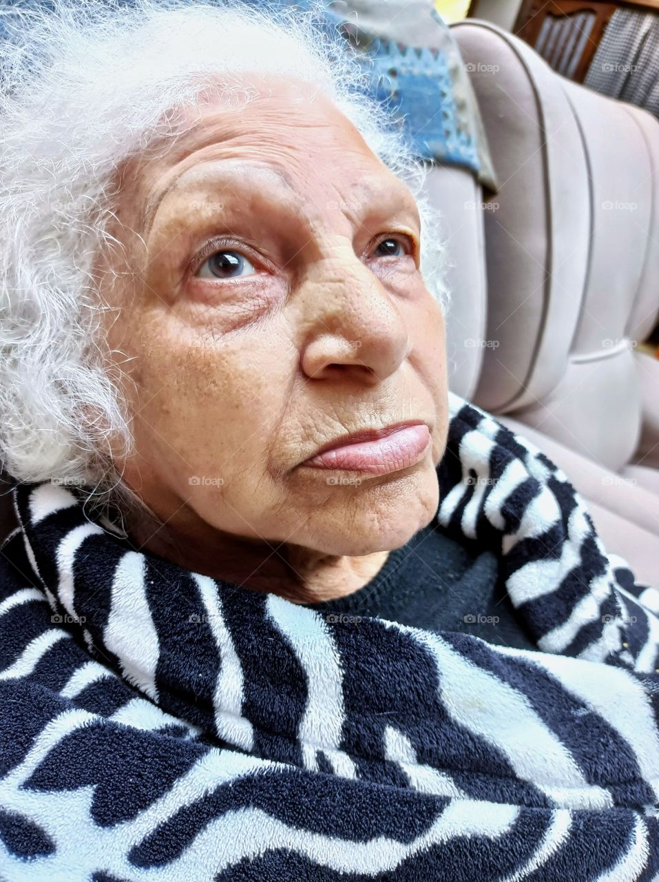 Pensive old lady with faraway look