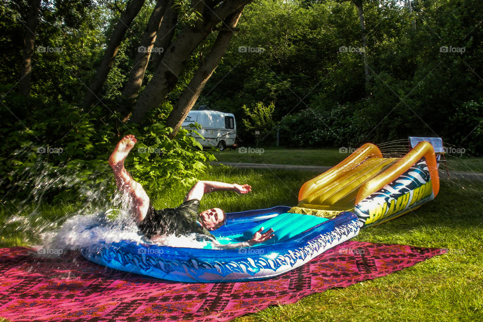 My fav moments are primarily times with my family. Some of my favourite moments involve catching photos of them playing. That includes Dad! Here he is trying out the kids slip and slide. Believe it or not it lasted all summer!