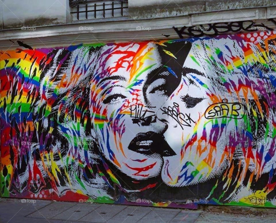 Cool light shot of the Madonna and LGBT graffiti in Paris