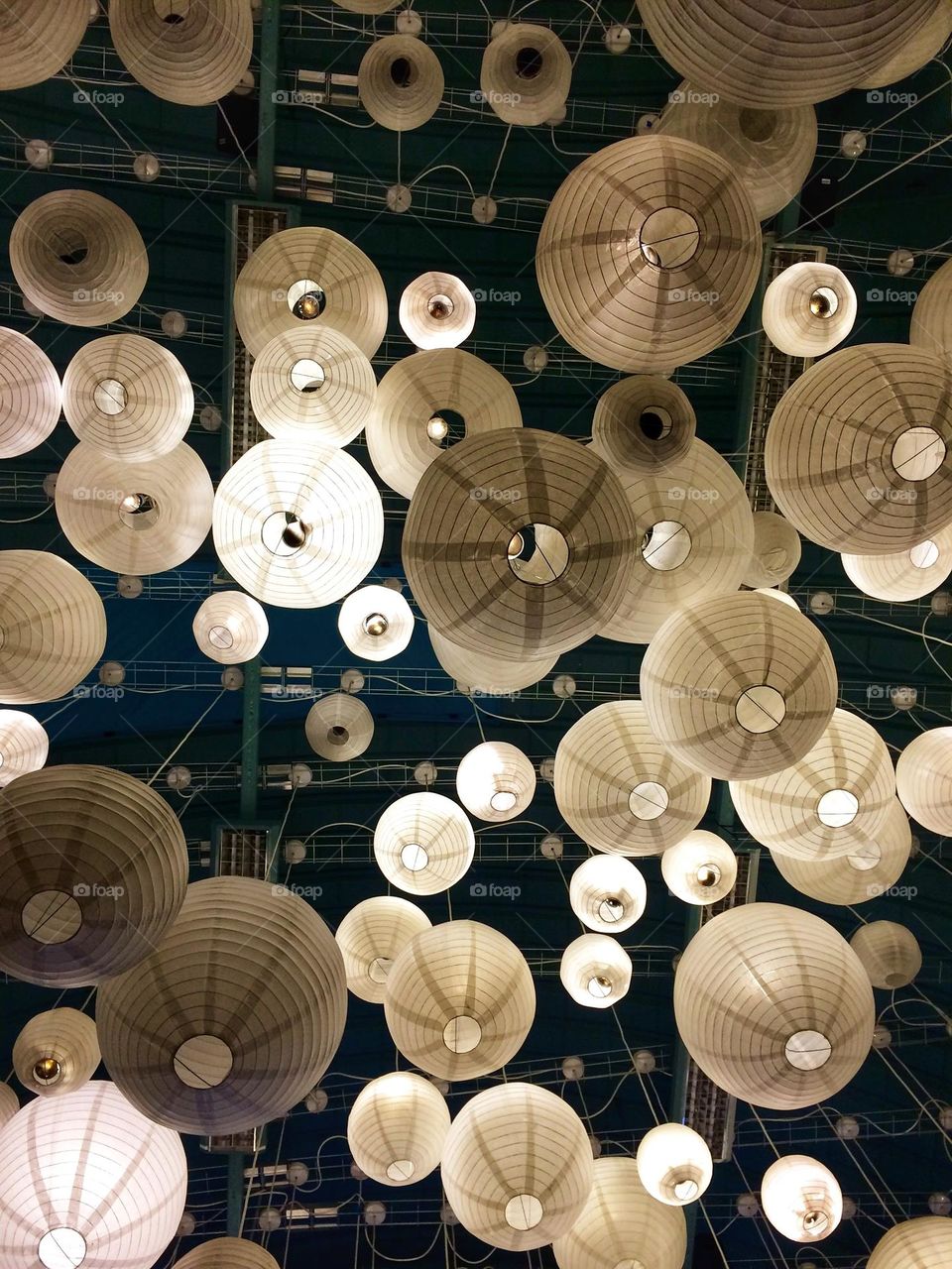 Lying on a bench in a restaurant looking up at the ceiling (What I do for Foap!)