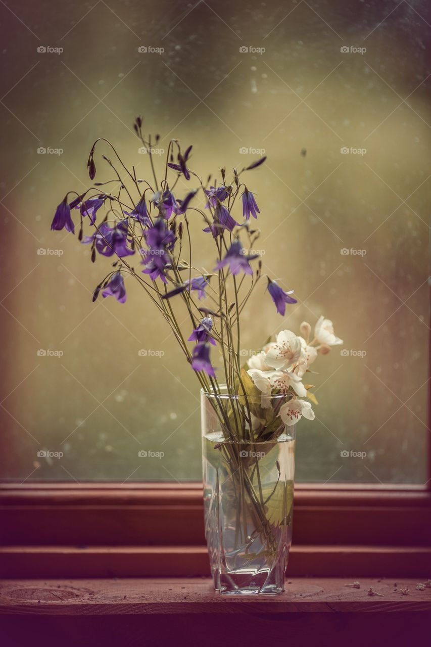 Meadow flowers bouquet in glass 