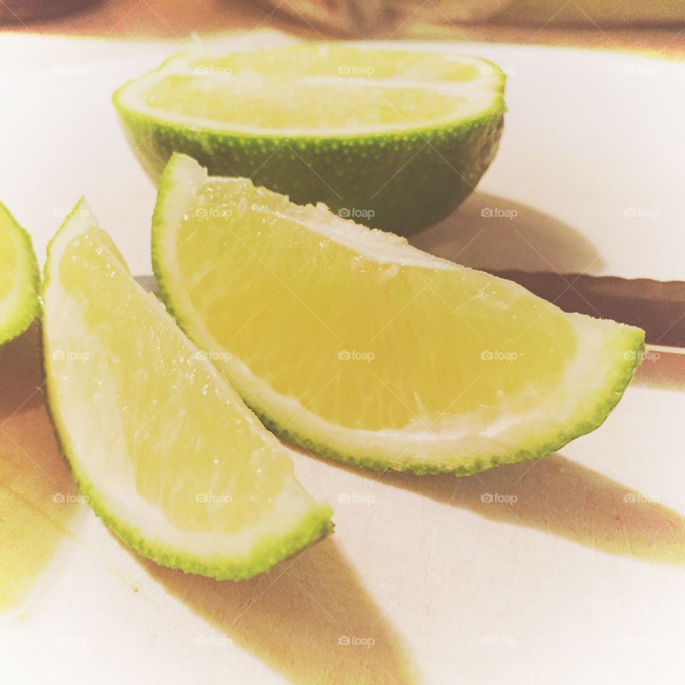 Sliced Limes. sliced limes on a cutting board