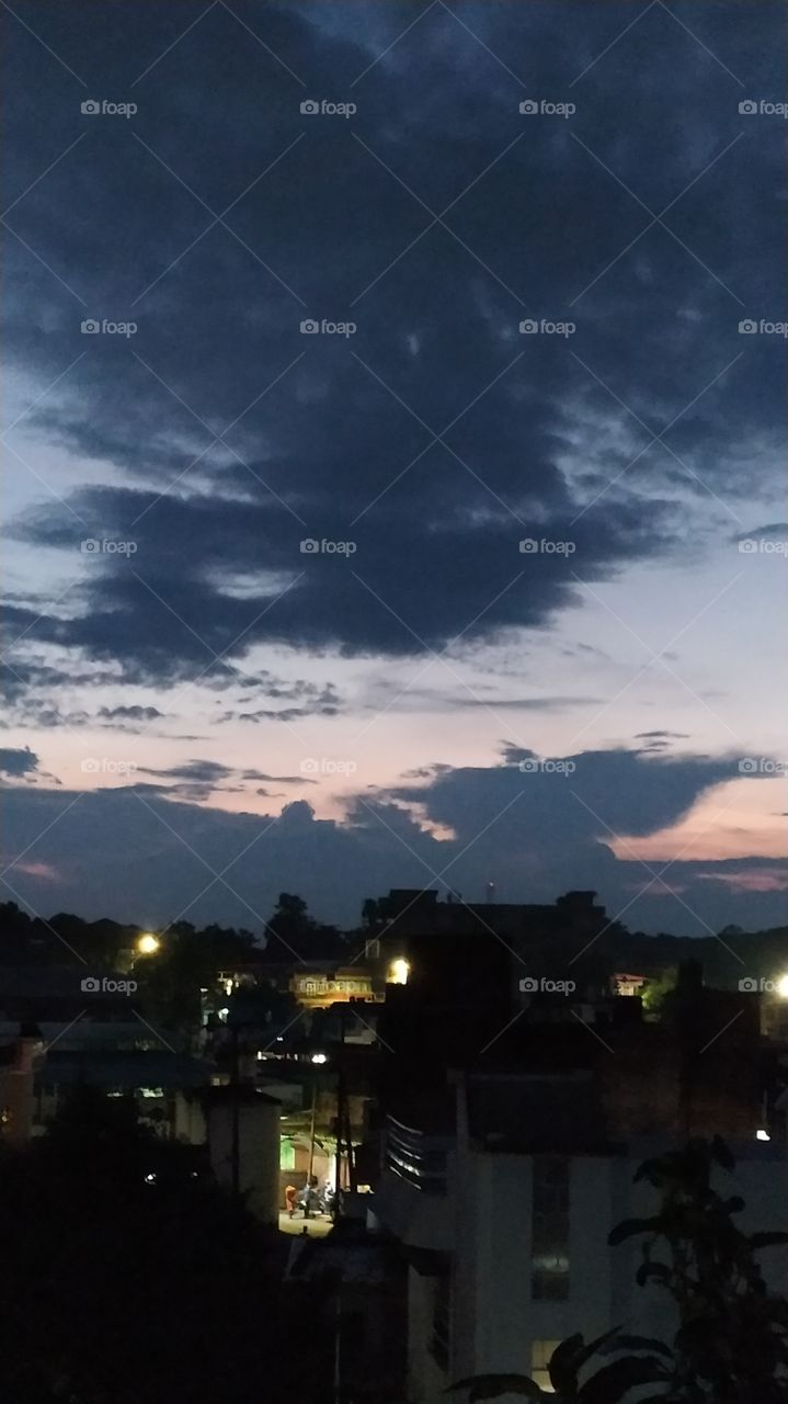 Dark clouds hovering over dark town