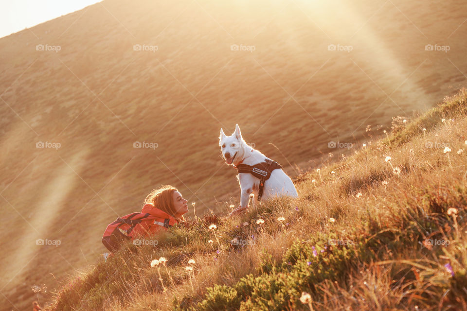 woman petting her wolf dog