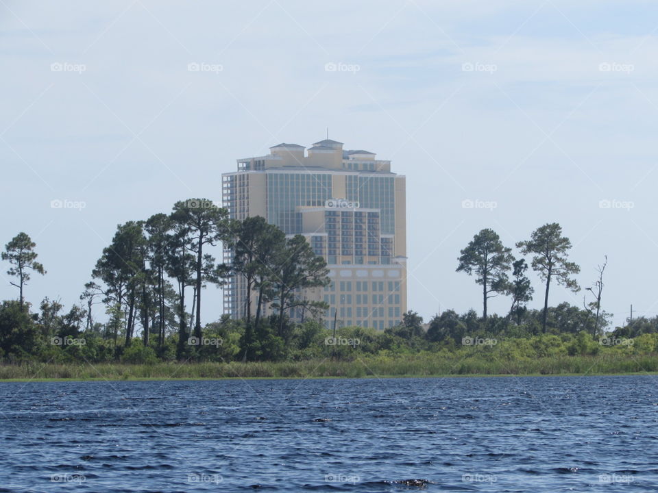 Building on beach behind the pond