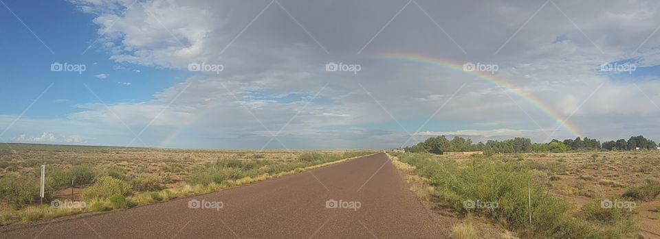 rainbow on desert road