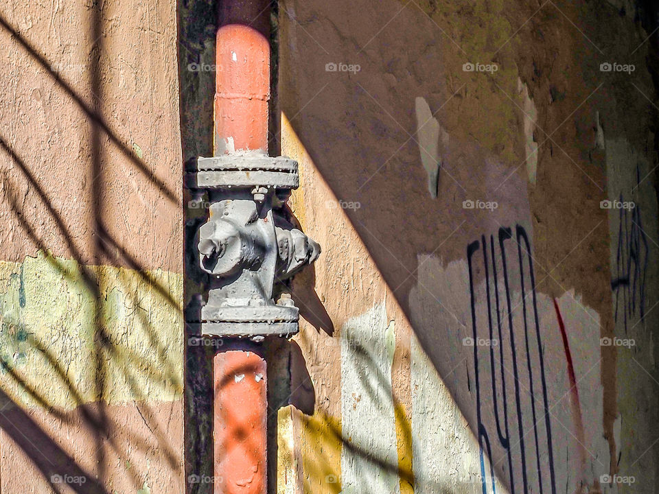 Old pipe with a crane in the gateway of St. Petersburg