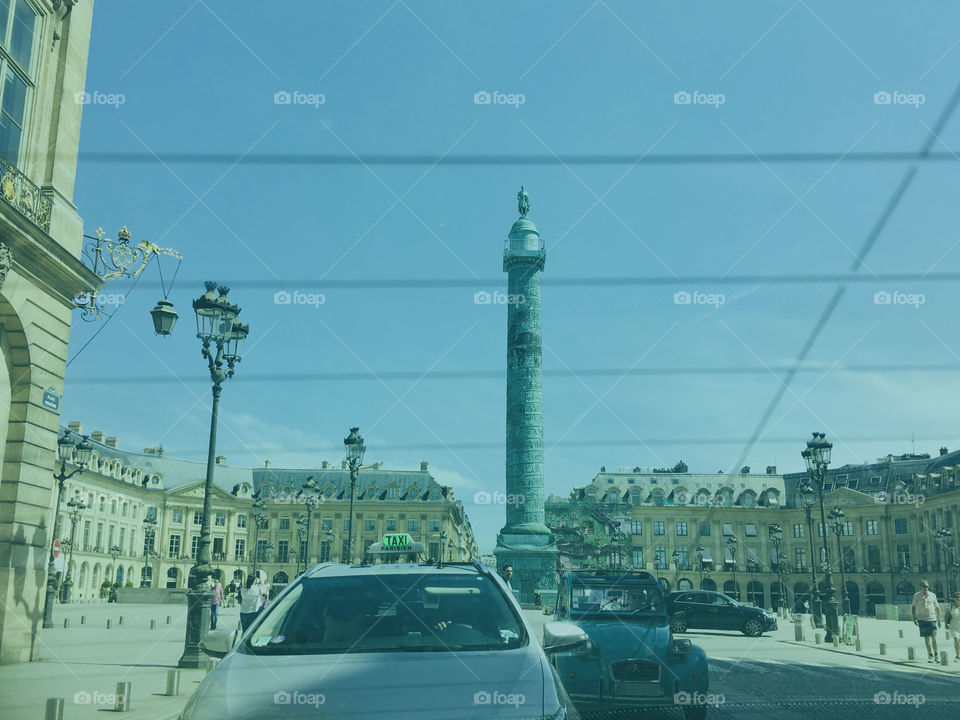 Place Vendome seen from tinted rear window of a taxi
